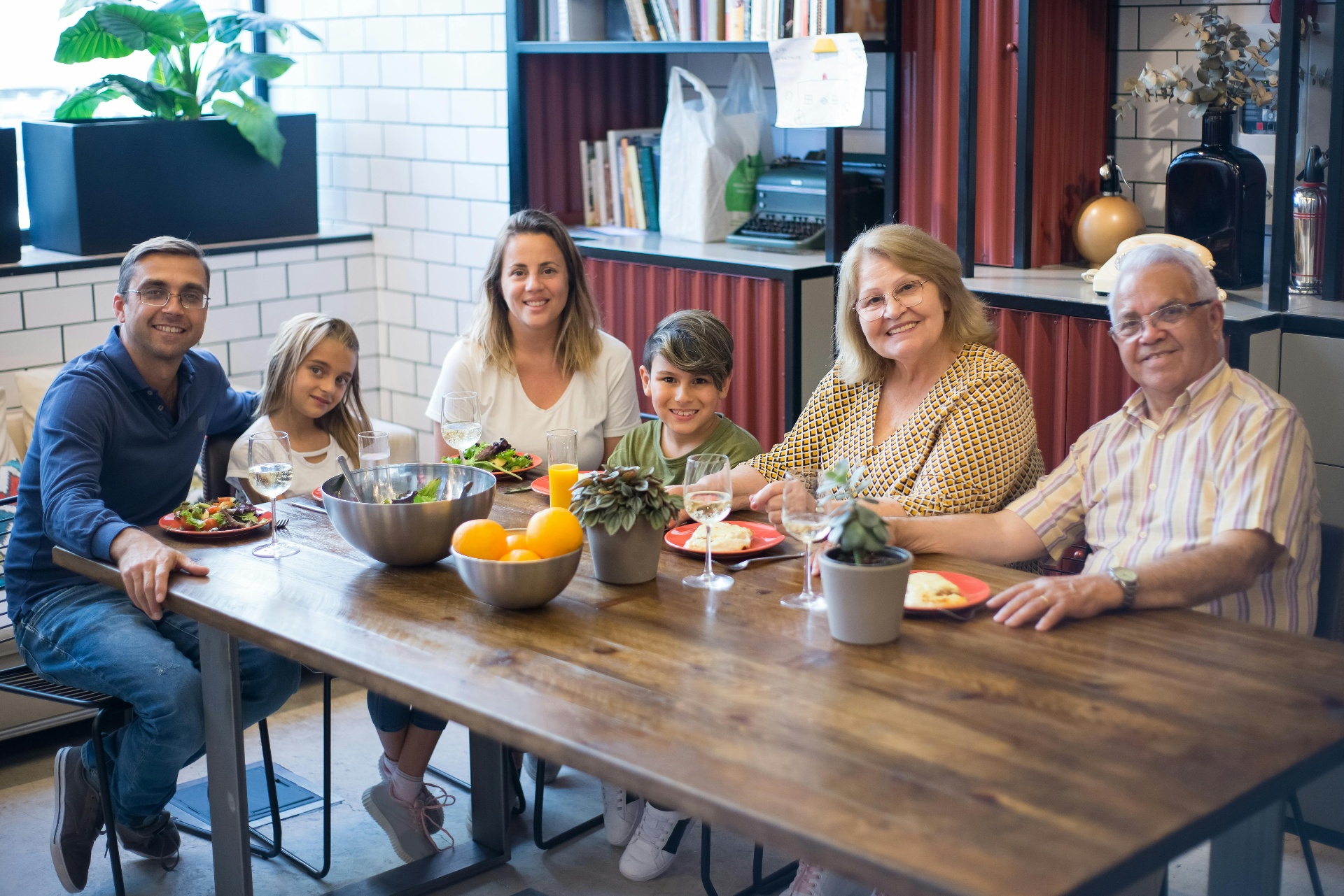 A multi-generational family sharing a meal together